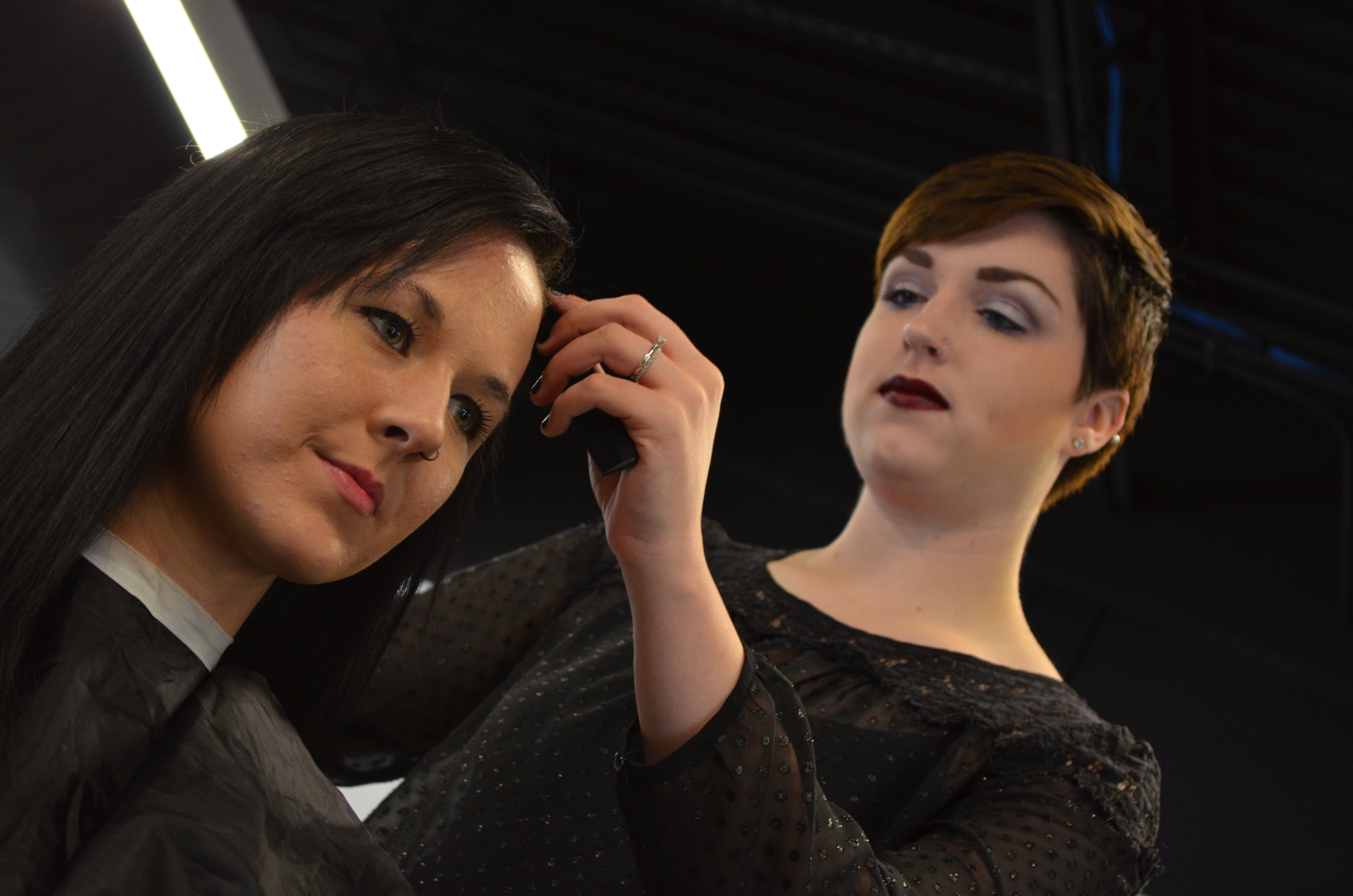 Young woman getting hair styled by MTEC cosmetology student